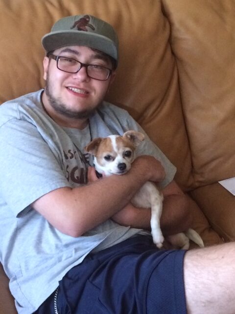 Andrew with his dog, Bella